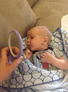 Discovering his reflection.