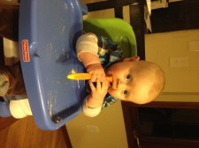 Trying to feed himself with a spoon. Needs practice...