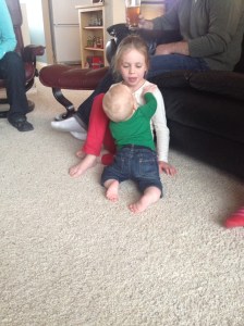 Climbing on cousin Molly.